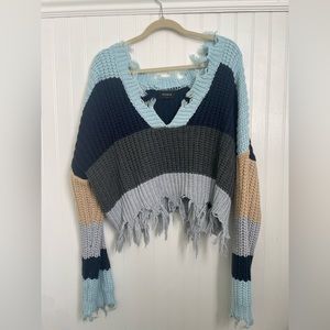 Cropped stripped sweater with fraying accents